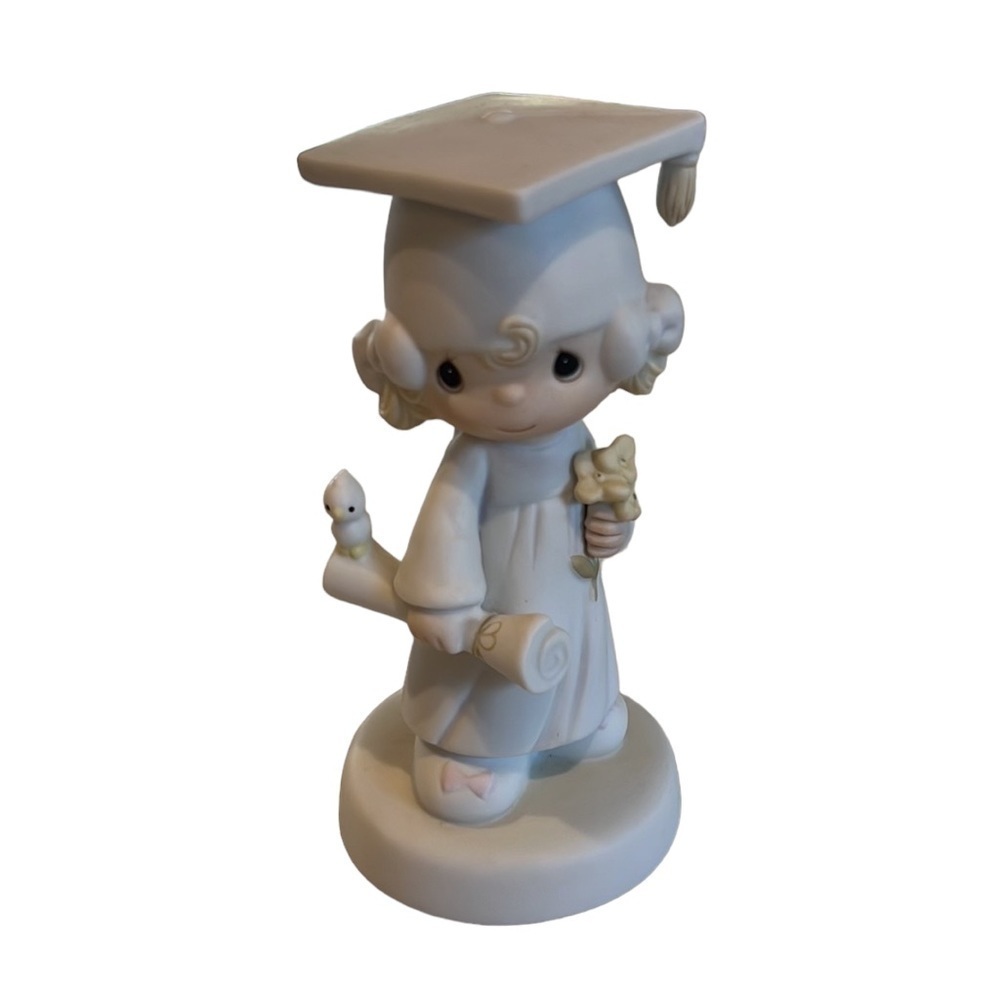 Precious Moments 1980 The Lord bless you and keep you” graduation figurine.